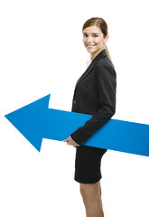 Image showing Business woman holding a blue arrow