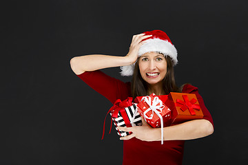 Image showing Woman holding christmas gifts