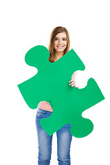 Image showing Woman holding a puzzle piece