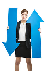 Image showing Business woman holding blue arrows