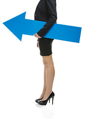 Image showing Business woman holding a blue arrow