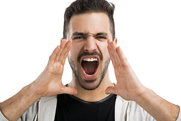 Image showing Portrait of a latin american young man shooting out loud