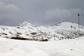 Image showing Ski slopes at gray day, in little snow year