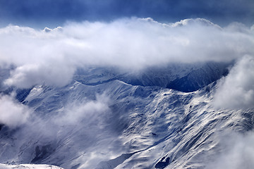 Image showing View on snowy mountains at mist