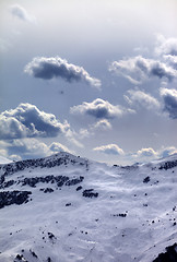 Image showing Off-piste slope and sunlight clouds