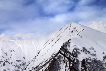 Image showing Off-piste slope in morning and sky with clouds