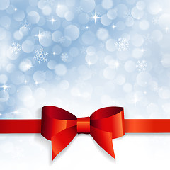 Image showing red bow on a background snowflakes