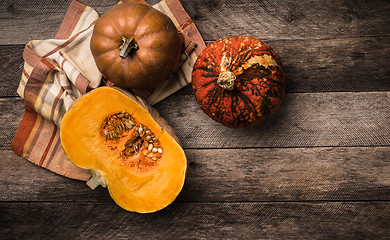 Image showing Rustic style pumpkins  with napkin and wood 
