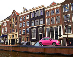 Image showing pink car on a canal in Amsterdam, Netherlands