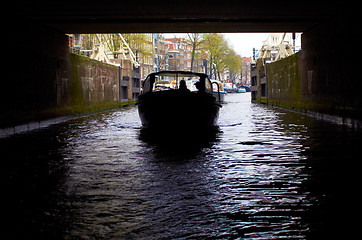 Image showing boat going under the bridge