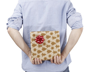 Image showing Young man holding a present