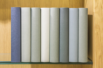 Image showing Books on glass shelf