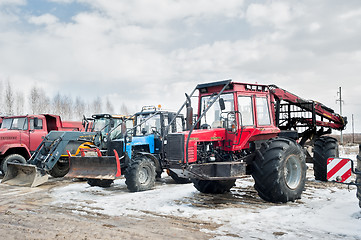 Image showing Tractors and truck stand on open area