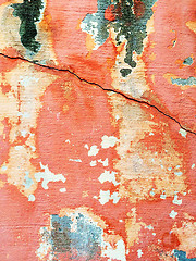 Image showing Cracked red wall with peeling paint