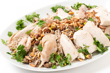 Image showing Lebanese chicken and spiced rice with nuts and parsley