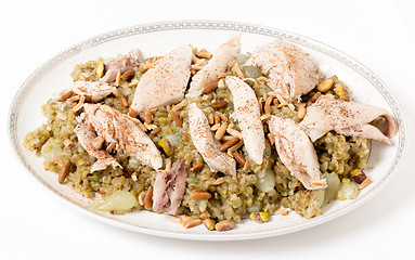 Image showing Cinnamon dusted chicken with frikeh and nuts