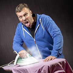 Image showing Man doing housework