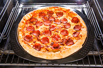 Image showing Pepperoni pizza in the oven.