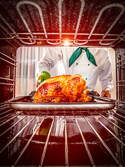 Image showing Cooking chicken in the oven.