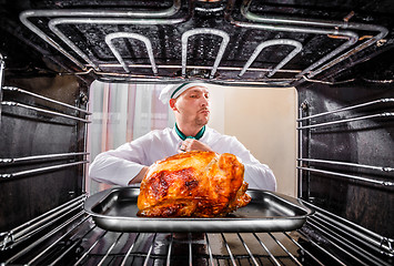 Image showing Cooking chicken in the oven.