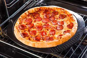 Image showing Pepperoni pizza in the oven.