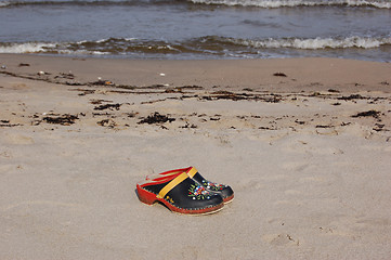 Image showing Clogs on the beach