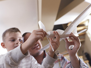 Image showing father and son assembling airplane toy