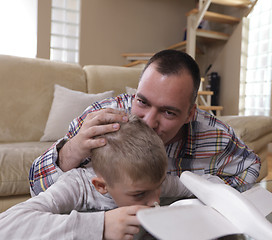 Image showing father and son assembling airplane toy