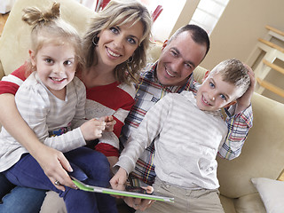 Image showing happy young family at home