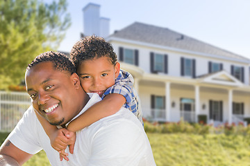 Image showing African American Father and Mixed Race Son, House Behind