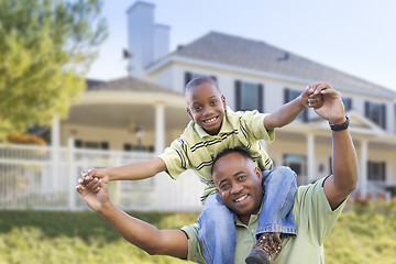 Image showing Playful African American Father and Son In Front of Home