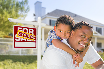 Image showing African American Father and Mixed Race Son, Sold Sign, House