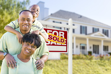 Image showing African American Family In Front of Sold Sign and House