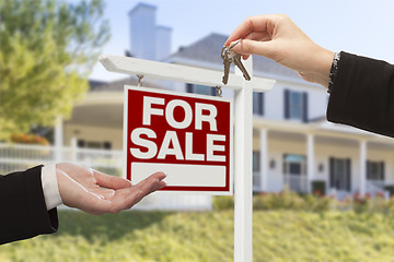 Image showing Agent Handing Over House Keys in Front of New Home