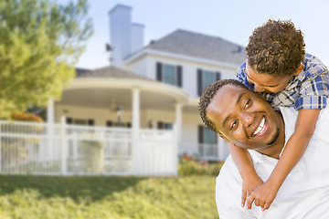 Image showing African American Father and Mixed Race Son, House Behind