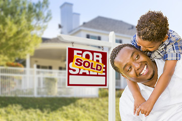 Image showing African American Father and Mixed Race Son, Sold Sign, House