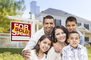 Image showing Hispanic Family in Front of Sold Real Estate Sign, House