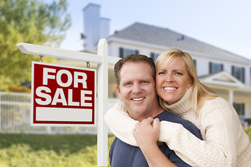 Image showing Couple in Front of New House and Real Estate Sign