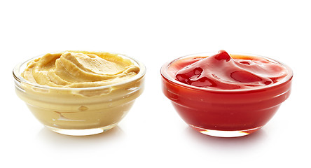 Image showing bowls of mustard sauce and ketchup