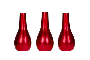 Image showing Three bright red vases isolated