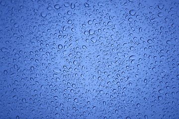 Image showing Natural water drops on glass