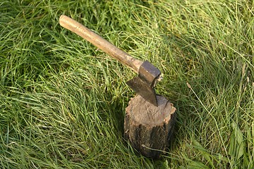 Image showing Firewood and old axe