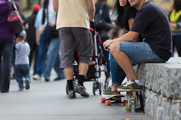 Image showing Young couple with skateboards.