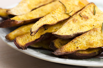 Image showing Portion of fresh baked sweet potato wedges