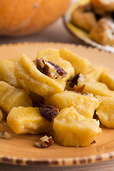 Image showing homemade pumpkin gnocchi with pecan nuts