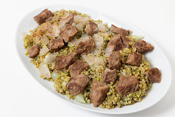 Image showing Serving dish of beef with freekeh