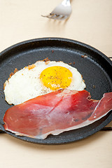 Image showing egg sunny side up with italian speck ham