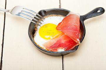 Image showing egg sunny side up with italian speck ham