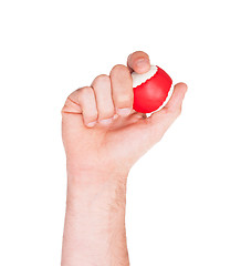 Image showing Male hand with a red and white ball