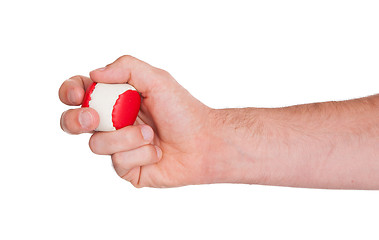 Image showing Male hand with a red and white ball